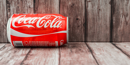 PUTRAJAYA MALAYSIA  JUNE 28TH 2015. Coca Cola can on weathered wood. Coca Cola drinks are produced and manufactured by The CocaCola Company an American multinational beverage corporation.のeditorial素材