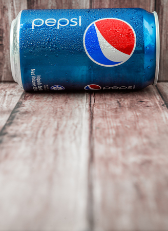 PUTRAJAYA MALAYSIA  JUNE 28TH 2015. Pepsi can on weathered wood. Pepsi is a carbonated soft drink produced and manufactured by PepsiCo Inc. an American multinational food and beverage company.のeditorial素材