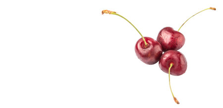 Red cherry fruits over white background