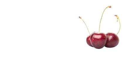 Red cherry fruits over white backgroundの写真素材
