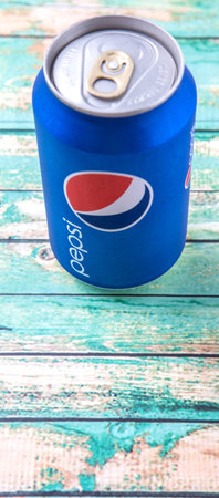 PUTRAJAYA, MALAYSIA - JULY 5TH, 2015. Pepsi can on weathered wood. Pepsi is a carbonated soft drink...