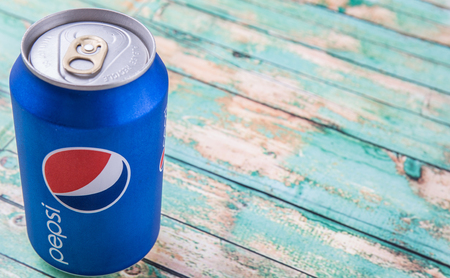 PUTRAJAYA, MALAYSIA - JULY 5TH, 2015. Pepsi can on weathered wood. Pepsi is a carbonated soft drink produced and manufactured by PepsiCo Inc. an American multinational food and beverage company.のeditorial素材