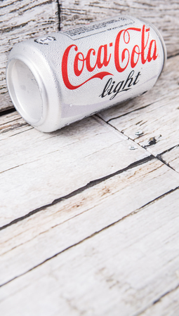 PUTRAJAYA, MALAYSIA - JULY 5TH, 2015. Coca Cola Light on weathered wood. Coca Cola drinks are produced and manufactured by The Coca-Cola Company, an American multinational beverage corporation.のeditorial素材
