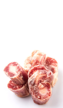Raw frozen ox tail on white backgroundの写真素材