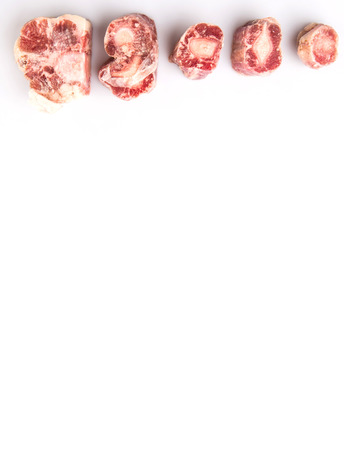 Raw frozen ox tail on white backgroundの写真素材