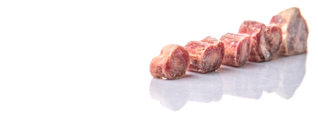 Raw frozen ox tail on white backgroundの写真素材