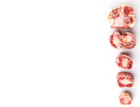 Raw frozen ox tail on white backgroundの写真素材