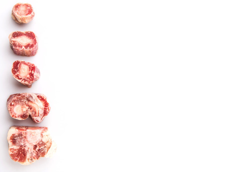 Raw frozen ox tail on white backgroundの写真素材