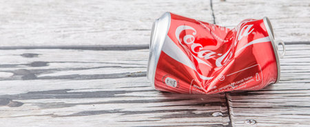 PUTRAJAYA, MALAYSIA - JULY 14TH, 2015. Crumpled Coca Cola cans. Coca Cola drinks are produced and manufactured by The Coca-Cola Company, an American multinational beverage corporation.のeditorial素材