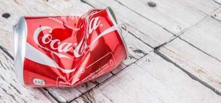 PUTRAJAYA, MALAYSIA - JULY 14TH, 2015. Crumpled Coca Cola cans. Coca Cola drinks are produced and manufactured by The Coca-Cola Company, an American multinational beverage corporation.のeditorial素材