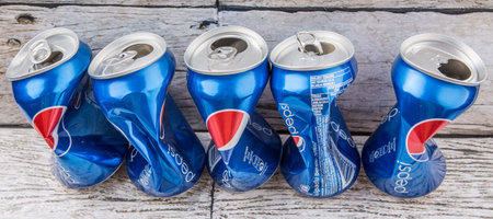 PUTRAJAYA, MALAYSIA - JULY 14TH, 2015. Crumpled Pepsi can. Pepsi is a carbonated soft drink produced...
