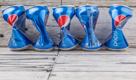 PUTRAJAYA, MALAYSIA - JULY 14TH, 2015. Crumpled Pepsi can. Pepsi is a carbonated soft drink produced and manufactured by PepsiCo Inc. an American multinational food and beverage company.のeditorial素材