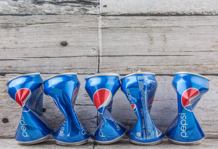 PUTRAJAYA, MALAYSIA - JULY 14TH, 2015. Crumpled Pepsi can. Pepsi is a carbonated soft drink produced...
