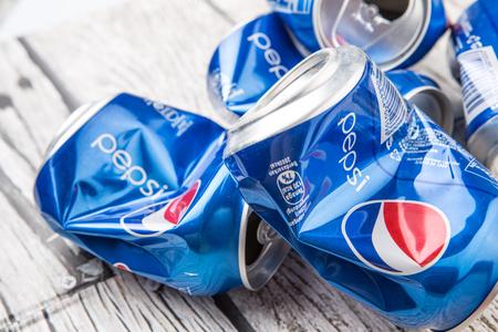 PUTRAJAYA, MALAYSIA - JULY 14TH, 2015. Crumpled Pepsi can. Pepsi is a carbonated soft drink produced and manufactured by PepsiCo Inc. an American multinational food and beverage company.のeditorial素材