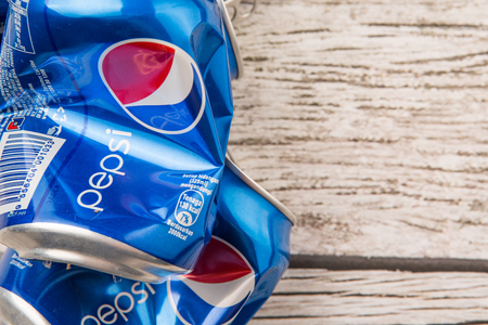 PUTRAJAYA, MALAYSIA - JULY 14TH, 2015. Crumpled Pepsi can. Pepsi is a carbonated soft drink produced and manufactured by PepsiCo Inc. an American multinational food and beverage company.のeditorial素材