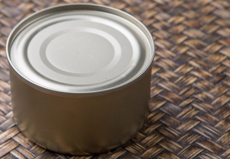 Short aluminum can over wicker background