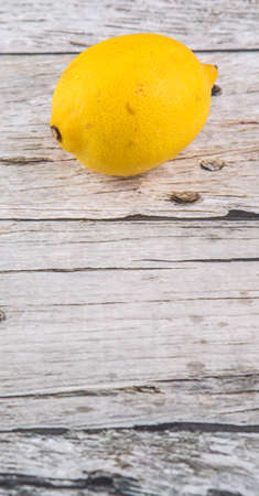 Lemon fruit over rustic wooden backgroundの写真素材