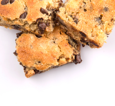 Sweet brownie dessert bar with chocolate chips over white backgroundの写真素材