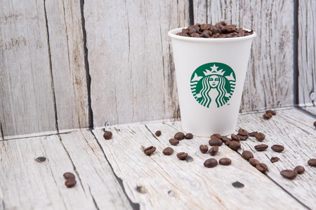 PUTRAJAYA, MALAYSIA - JULY 20TH, Coffee beans in Starbucks paper cup. Founded in 1971, Starbucks is the largest coffeehouse company in the world.のeditorial素材