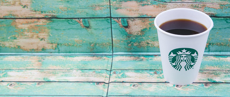 PUTRAJAYA, MALAYSIA - JULY 20TH, 2015. Starbuck coffee over wooden background. Founded in 1971, Starbucks is the largest coffeehouse company in the world.のeditorial素材