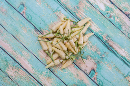 Thai chili or bird\'s eye chilies over wooden background