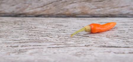 Thai chili or bird's eye chili over wooden backgroundの写真素材