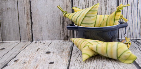Malay dish ketupat daun palas or rice dumpling where glutinous rice is wrapped in a triangular shape...