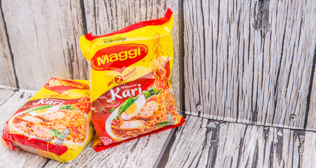 KUALA LUMPUR, MALAYSIA - MARCH 15TH 2015. Maggi instant noodles. Owned by Nestle, Maggi is an international brand of soups, stocks, bouillon cubes, ketchups, sauces, seasonings and instant noodles.のeditorial素材