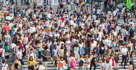 TOKYO, JAPAN - AUGUST 8TH, 2015. Pedestrian crossing the famous Shibuya Crossing. Shibuya is known as one of the fashion centers of Japan, particularly for young people, and as a major nightlife area.のeditorial素材
