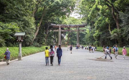 TOKYO, JAPAN - AUGUST 16TH 2015. Torii, a traditional Japanese gate at the entrance of Meiji Shinto Shrine located in Shibuya, Japan.のeditorial素材