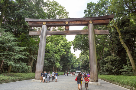 TOKYO, JAPAN - AUGUST 16TH 2015. Torii, a traditional Japanese gate at the entrance of Meiji Shinto Shrine located in Shibuya, Japan.のeditorial素材
