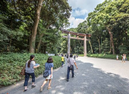 TOKYO, JAPAN - AUGUST 16TH 2015. Torii, a traditional Japanese gate at the entrance of Meiji Shinto Shrine located in Shibuya, Japan.のeditorial素材