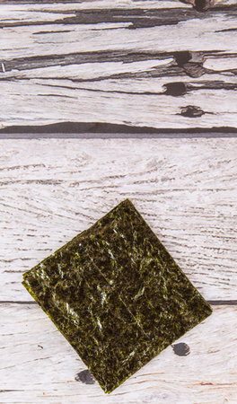 Edible seaweed or Nori in Japanese language over wooden backgroundの写真素材