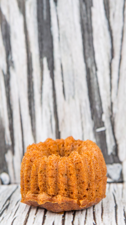 Malaysian dessert dish steamed caramelized sweet and soft cake, locally known as Kuih Apam Gula Hangus on wooden background.の写真素材