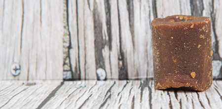 Brown coconut sugar over wooden backgroundの写真素材