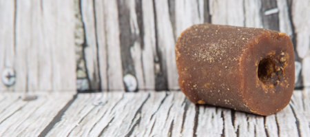 Brown coconut sugar over wooden backgroundの写真素材