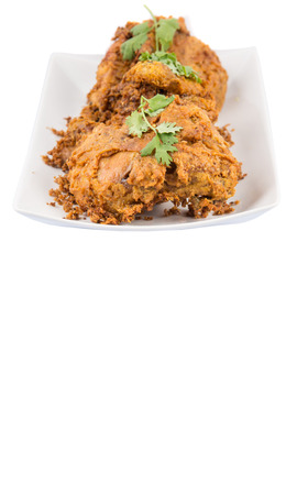 Popular Javanese dish Ayam Penyet or crispy fried chicken in a white plateの写真素材