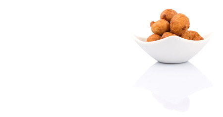 Popular Malaysian fritter snack deep fried banana balls or locally known as Cekodok Pisang over white backgroundの写真素材