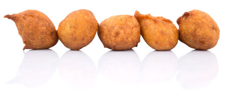 Popular Malaysian fritter snack deep fried banana balls or locally known as Cekodok Pisang over...