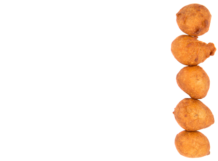 Popular Malaysian fritter snack deep fried banana balls or locally known as Cekodok Pisang over white backgroundの写真素材