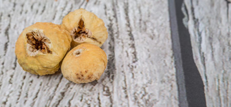 Dried fig over rustic wooden backgroundの写真素材