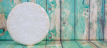 Blue cheese over wooden backgroundの写真素材