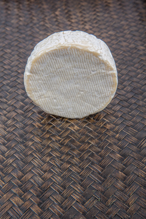 Blue cheese over wicker backgroundの写真素材