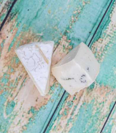 Blue cheese over wooden backgroundの写真素材