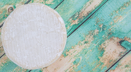 Blue cheese over wooden backgroundの写真素材