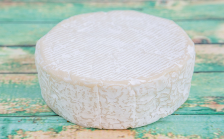 Blue cheese over wooden backgroundの写真素材