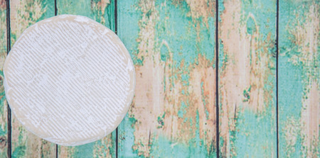 Blue cheese over wooden backgroundの写真素材