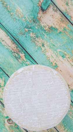 Blue cheese over wooden backgroundの写真素材