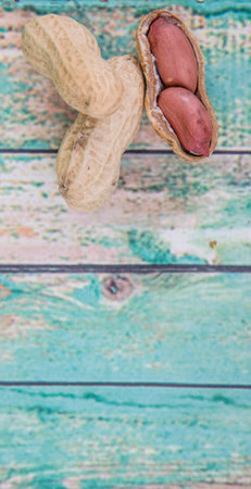 Peanut or ground nut over wooden backgroundの写真素材