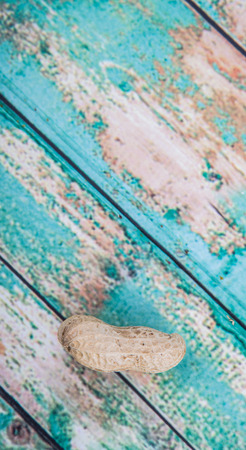 Peanut or ground nut over wooden backgroundの写真素材